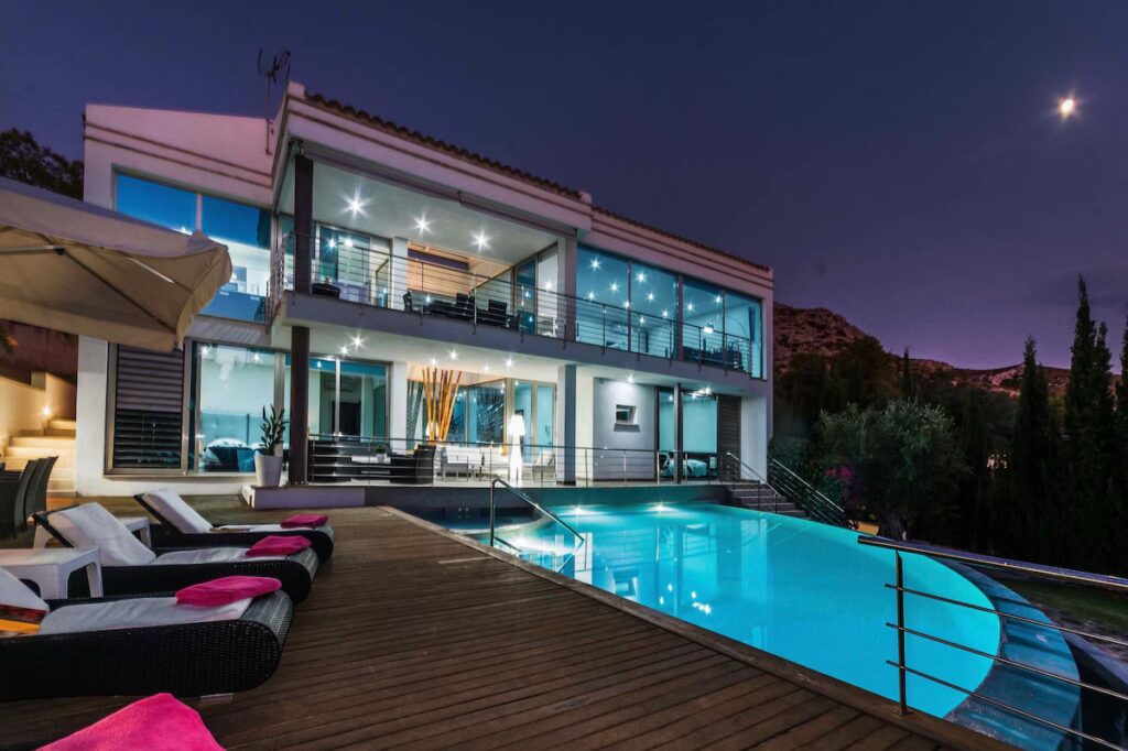 Luxury Villa Rockstar illuminated at night in Alcúdia Mallorca with private pool and terrace