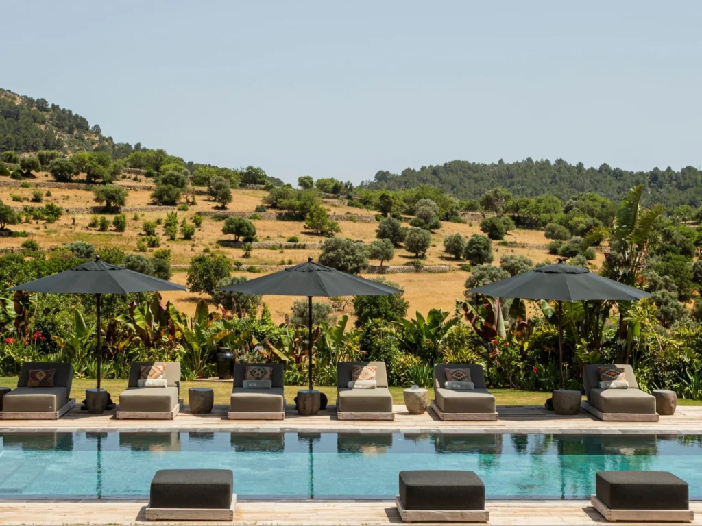 Sun loungers beside the pool at Spirit of Son Fuster luxury villa in Alaró Mallorca