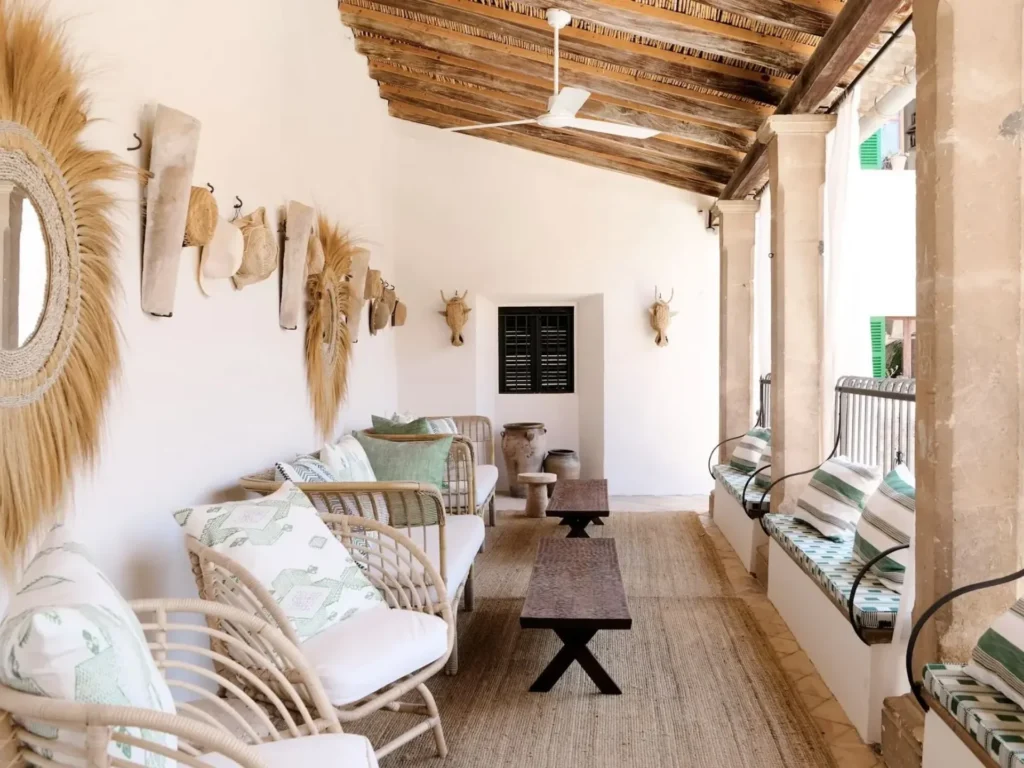 Covered terrace at Can Frontera Sóller with cushioned seating and exposed wooden roof