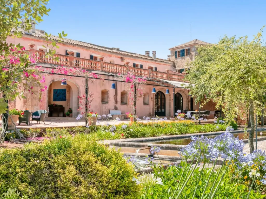 Formal Mediterranean garden with fountain and reflecting pools at Son Doblons luxury villa estate in Santa Margalida, Mallorca