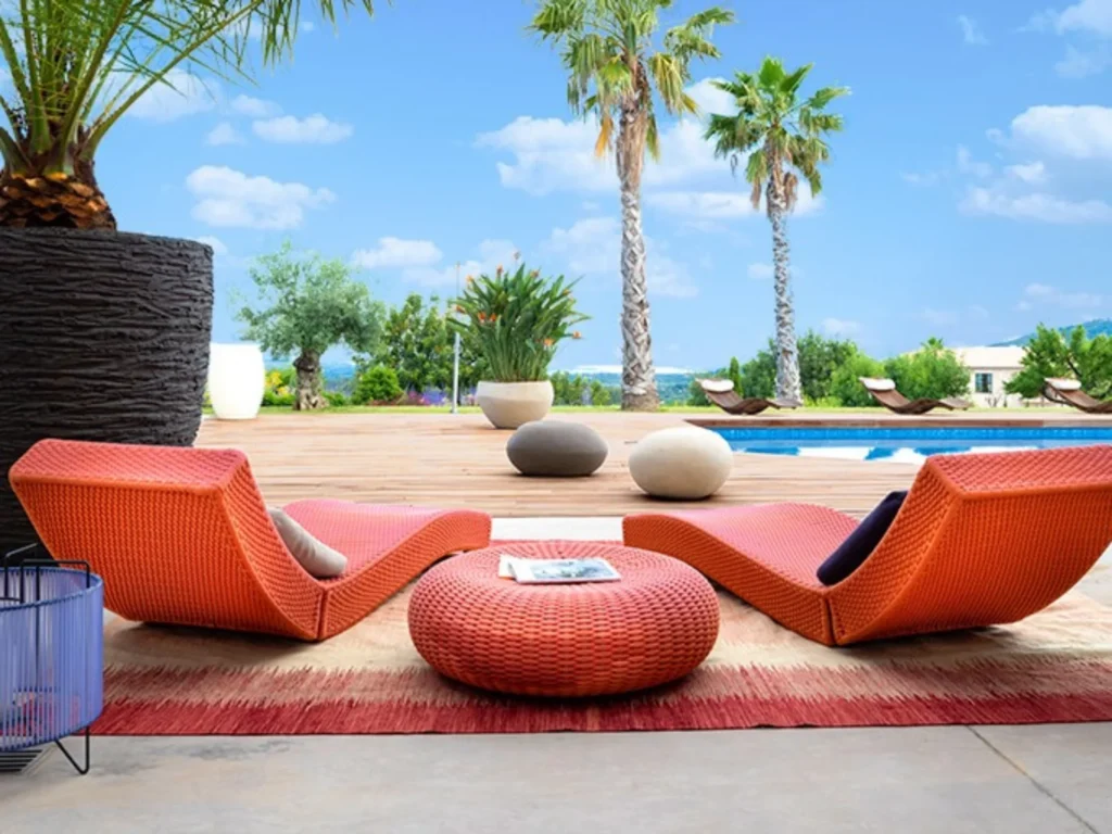 Outdoor lounge area with pool view at Villa Dalt luxury villa in Inca Mallorca